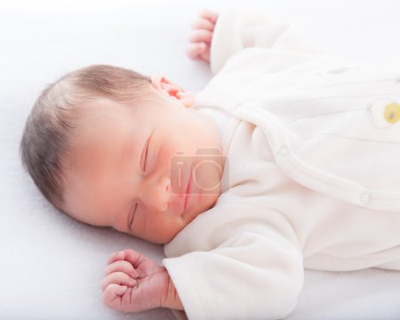 Infant sleeping in bed