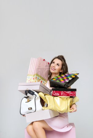 Brunette lady with heap of fashion accesories