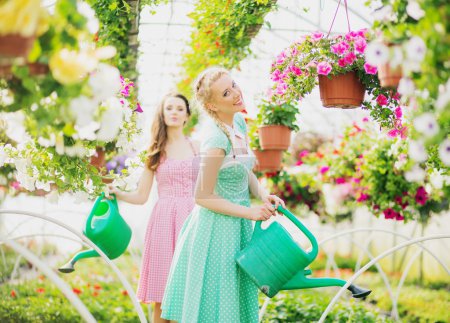 Two rustic girls in the green house