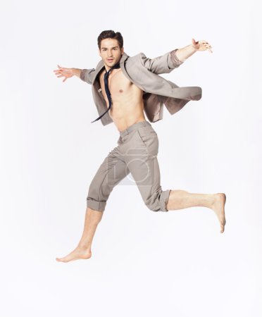 Handsome jumping man on suit isolated on a white background