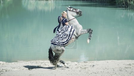 Portrait of the blonde riding a horse