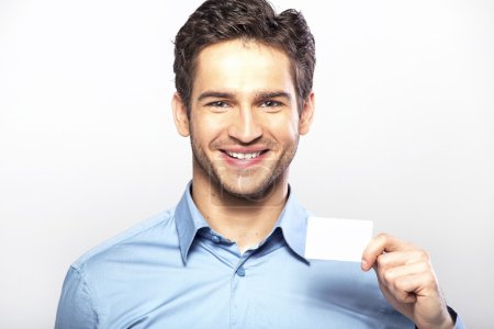 Smiling handsome guy with business card