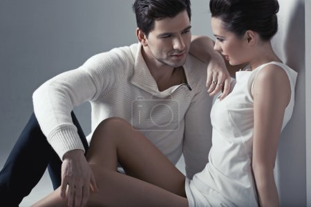 Handsome man touching soft skin of woman