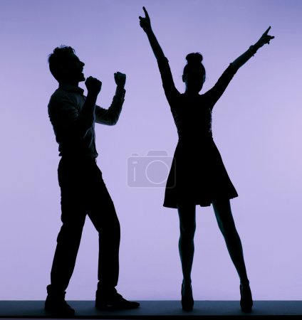 Joyful young couple dancing together