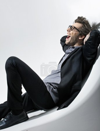 Picture of seated young fashion man