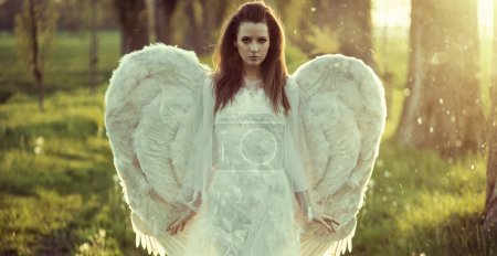 Delicate woman dressed as an angel