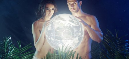 Attractive young couple holding shiny Earth
