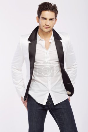 Handsome young guy wearing white jacket