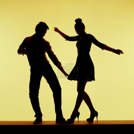 Two silhouettes on the dance-floor