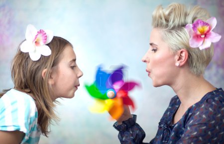 Colorful picture of playing mother and daughter
