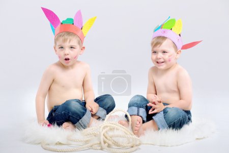 Two cute boys with indian hats