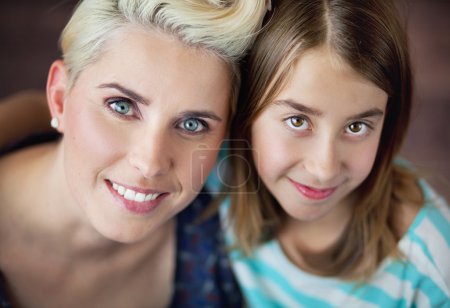 Smiling blonde woman with daughter