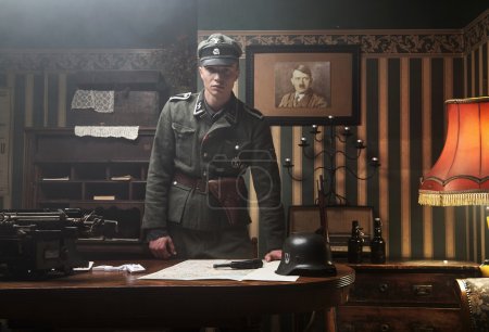 Tall blonde german soldier in his office