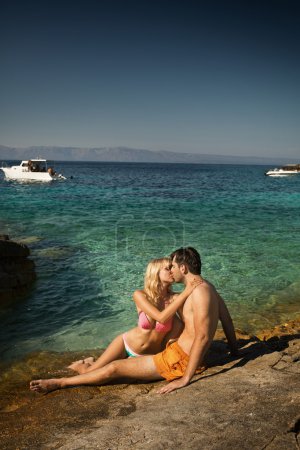 Lovely couple kissing near the seaside