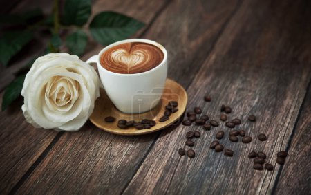 Hot coffee and beautiful white rose