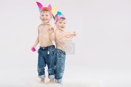 Two brave boys playing Indians