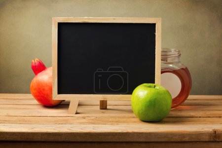 Chalkboard with honey and apple