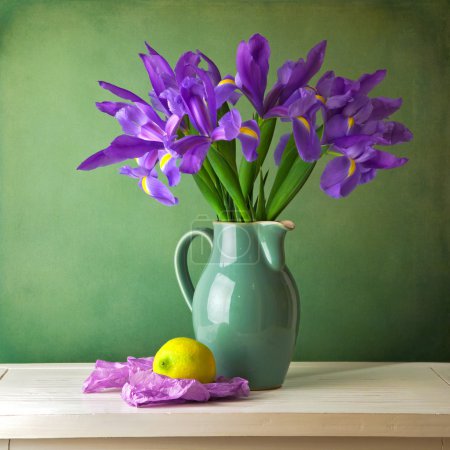 Beautiful still life with iris flower over grunge background
