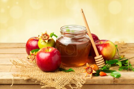 Honey jar with apples and pomegranate