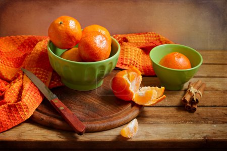 Still life with orange mandarins on wooden table