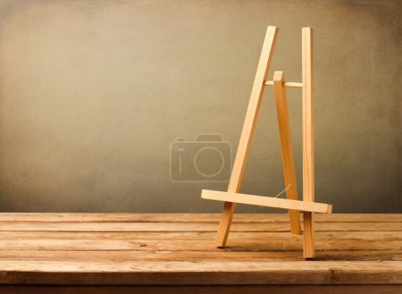 Background with empty wooden tripod
