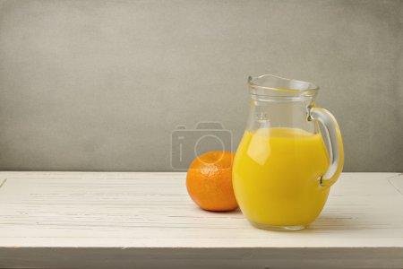 Orange juice with fresh tangerine