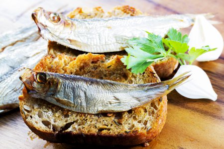 Fish, Spanish tapas - sprat on baked bread