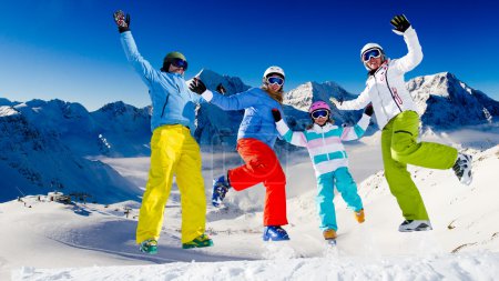 Ski, snow and winter fun - happy family ski team
