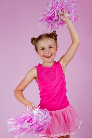 Cheerleader girl with pompoms, lovely little cheerleader kid
