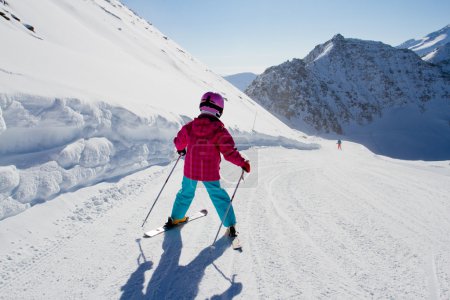 Skiing, winter, kid - skier on mountainside