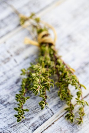 Thyme herbs on the wooden table