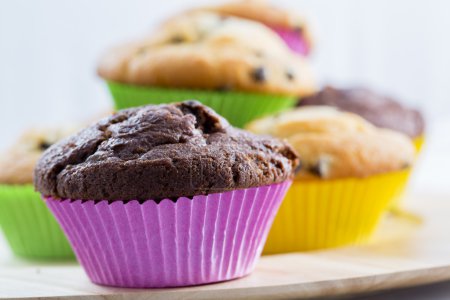 Muffins - homemade cupcakes in colorful molds