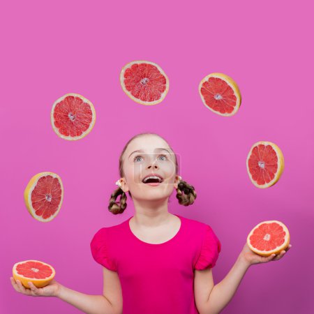Grapefruit, healthy eating - a young girl juggling grapefruits