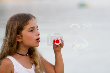 Summer joy, Soap bubbles - lovely girl blowing bubbles