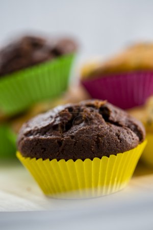 Muffins - homemade cupcakes in colorful molds