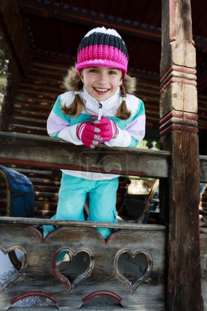 Winter, child, apres ski - young girl enjoying winter vacation