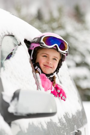 Winter, ski - happy child on the road for ski holidays