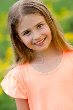 Happy child - outdoor portrait of adorable girl