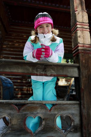 Winter, child, apres ski - young girl enjoying winter vacation