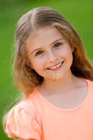 Happy child - outdoor portrait of adorable girl