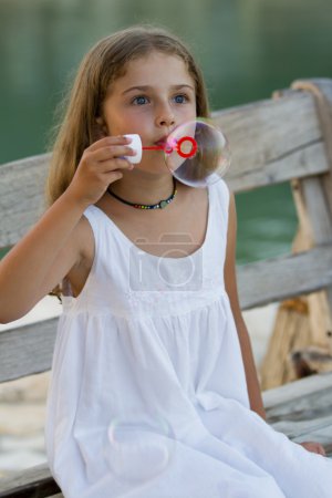 Summer joy, Soap bubbles - lovely girl blowing bubbles