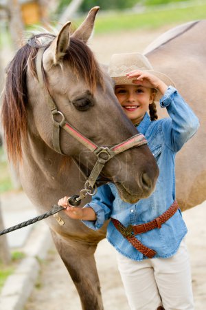 Ranch - Lovely girl with horse on the ranch