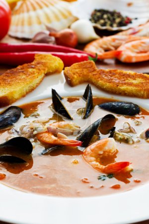 Bouillabaise, fish soup - traditional French fish soup with mussels and shrimp