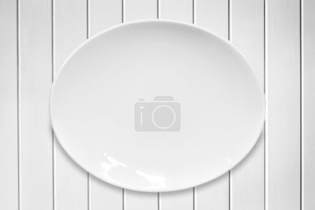 White Oval Plate on White Timber 