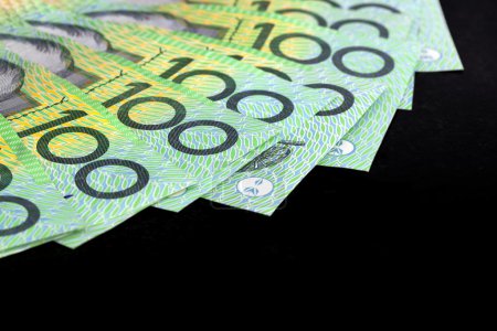Australian One Hundred Dollar Bills over Black