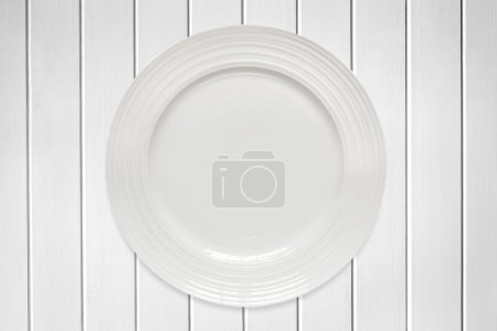 Empty Round Plate on White Timber