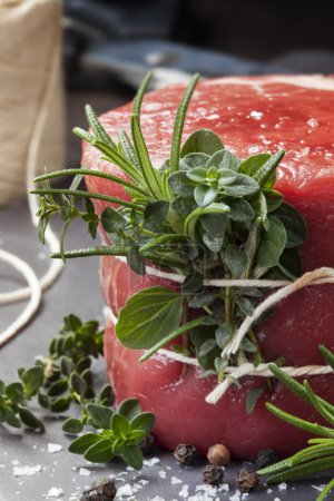 Raw Beef Fillet Steak with herbs