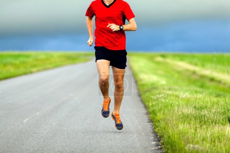 Man running on country road