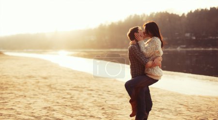 couple in love kissing on the beach