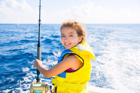 kid girl boat fishing trolling rod reel and yellow life jacket